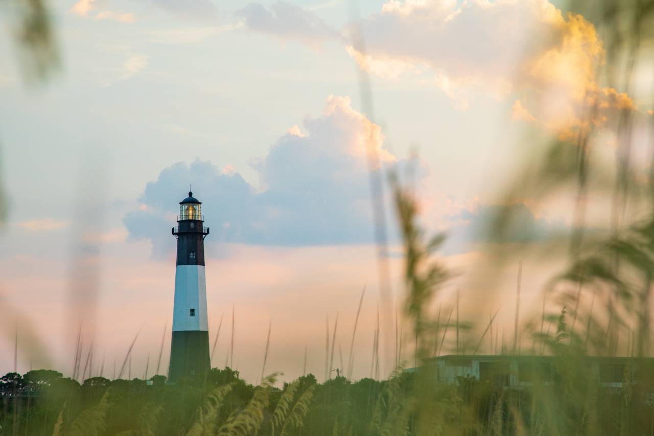 A lighthouse at sunset on Tybee Island, Georgia. The island is located in Chatham County, where the Smart Sea Level Sensors program is being implemented. Credit: Impact Media Lab / AAAS